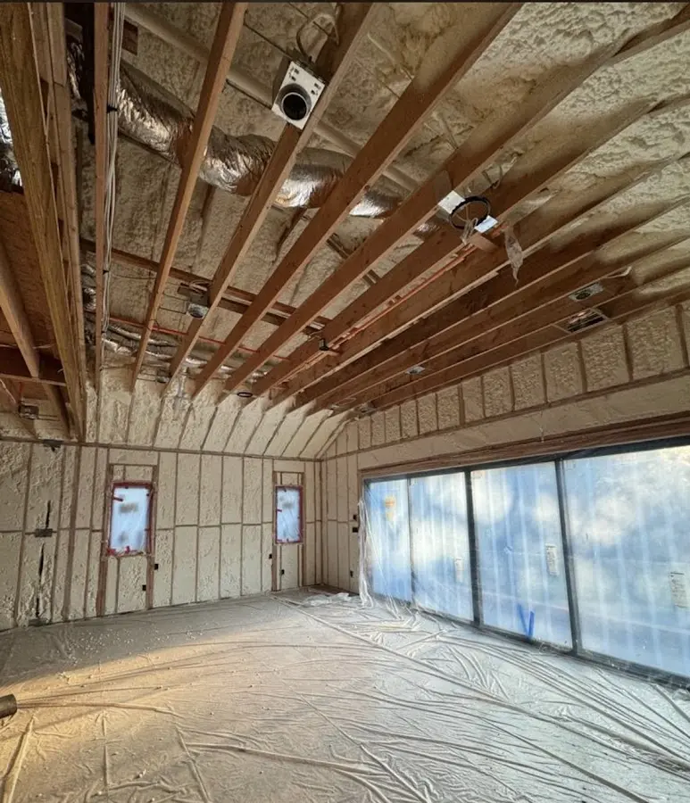 Interior walls and ceiling insulated with spray foam during new construction in Woodland